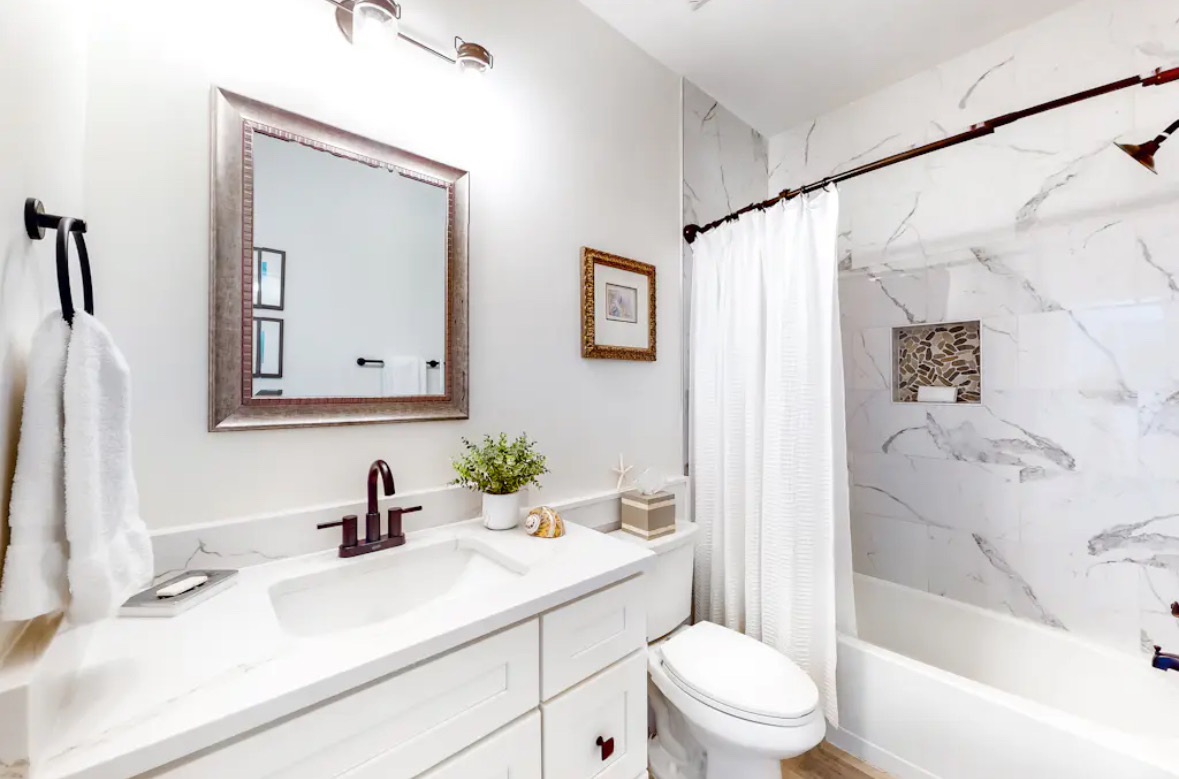 Bathroom with vanity and bathtub